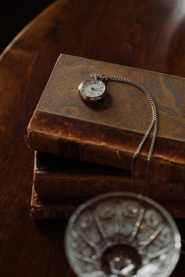 pocket watch on book